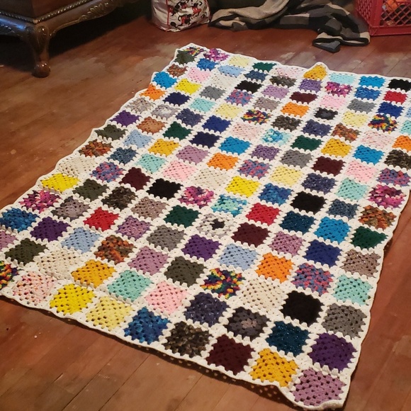 Granny square afgan measures 50 inches by 80 inches